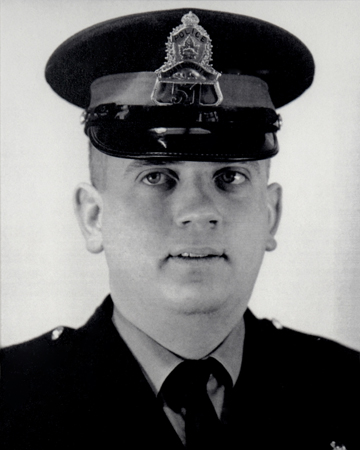 Photo of Corporal Eric Spicer wearing a Dartmouth Police Department forage cap