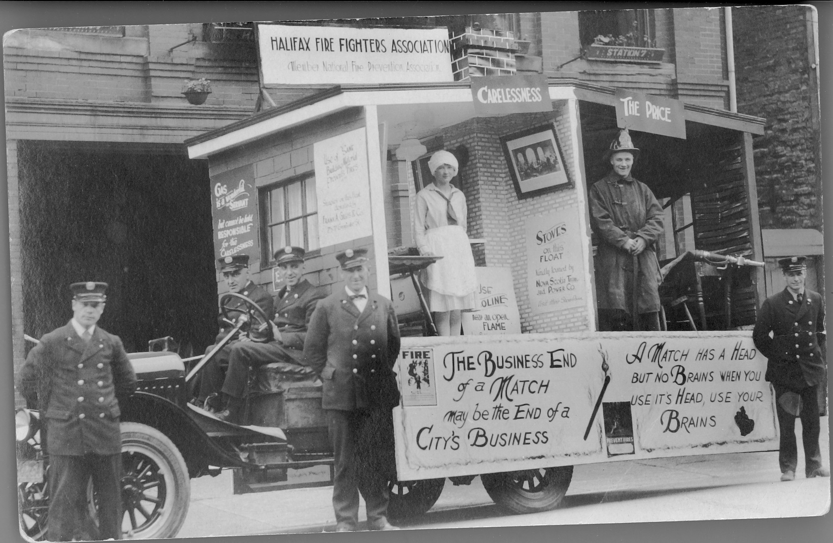 Black and white photo of participants in a parade.