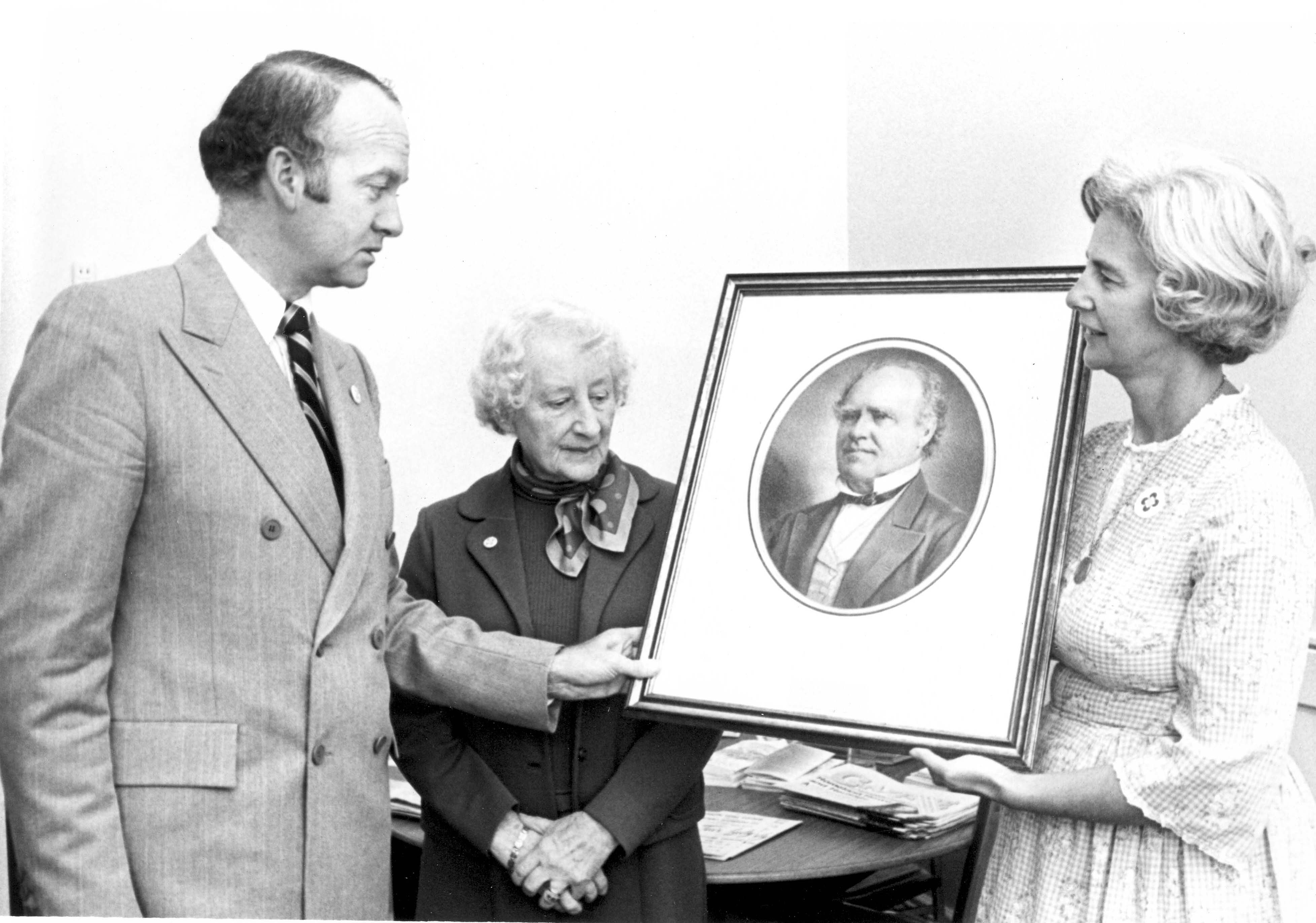 Black & white photo of an event for the ceremonial presentation of a portrait