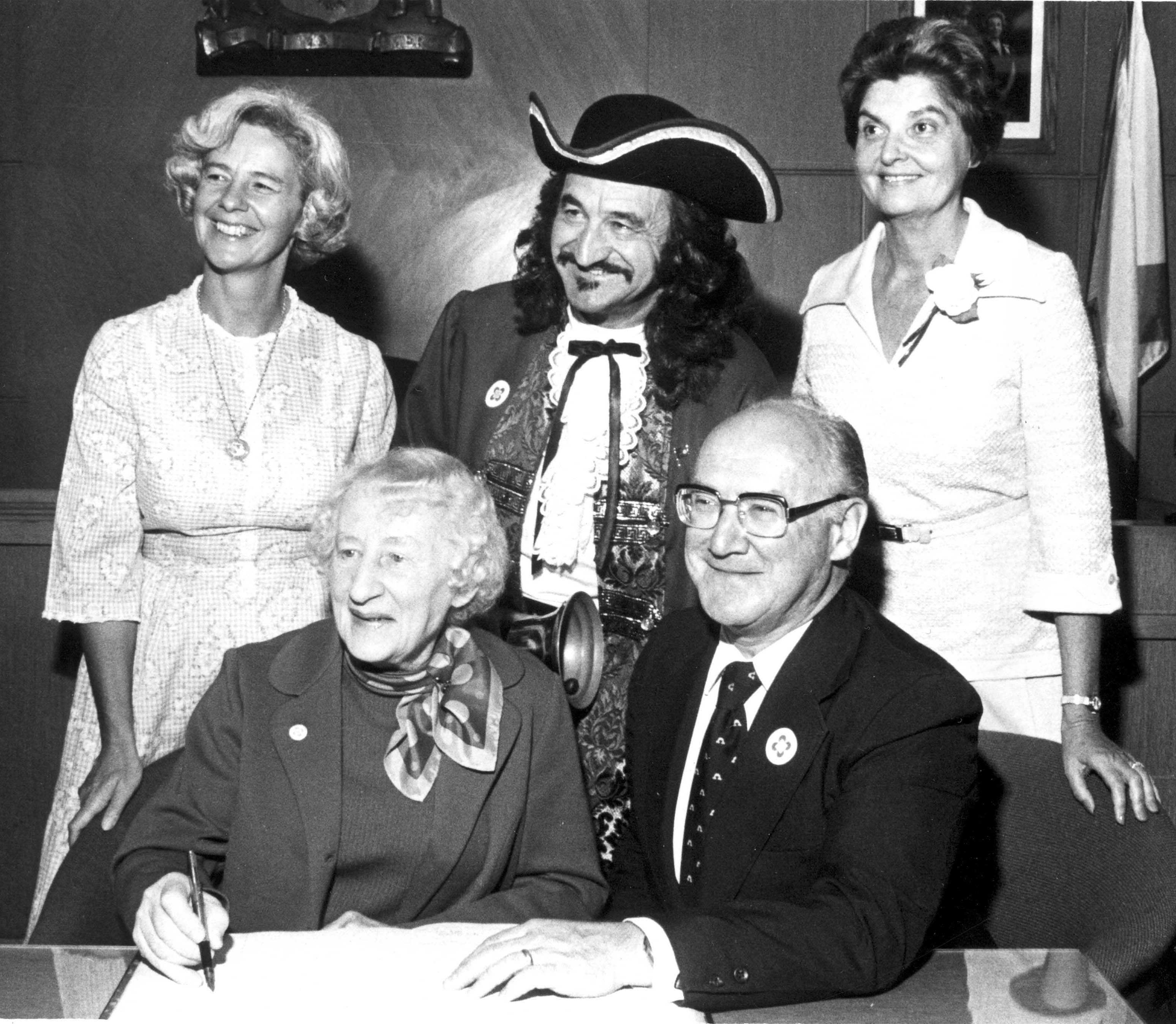 Black & white photo of a signing ceremony