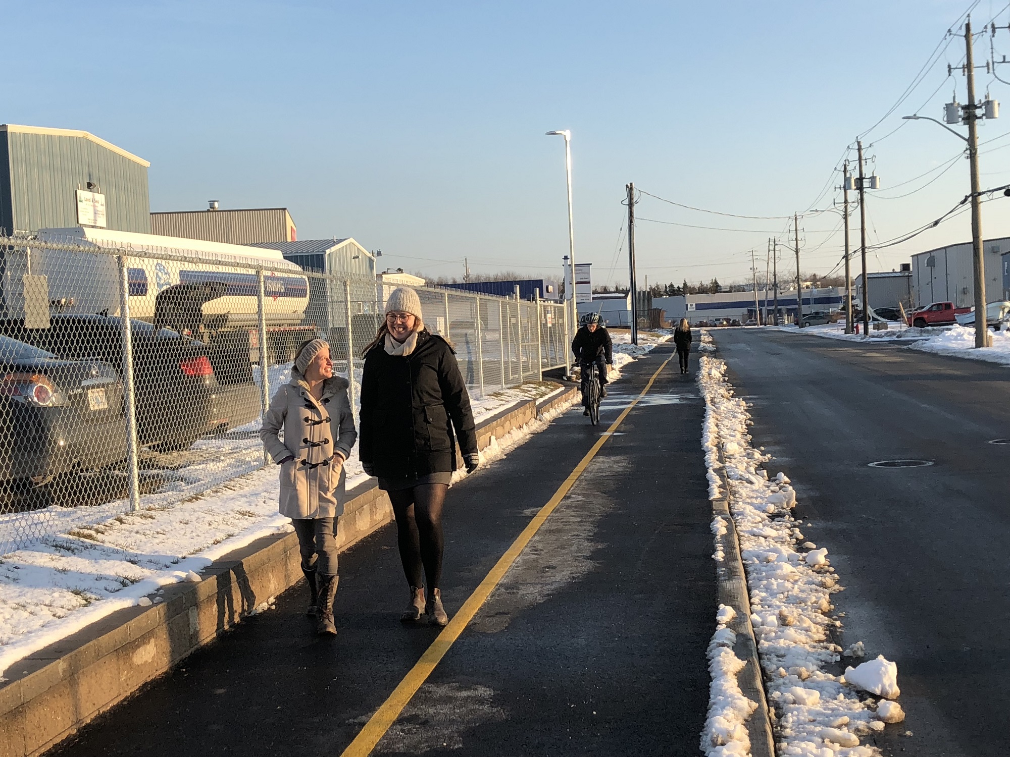 People walking and cycling on the Mount Hope Greenway. 