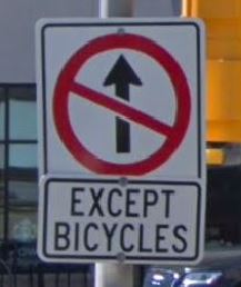 No through except bicycles sign