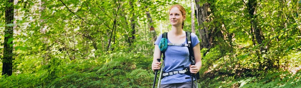 A Woman is hiking in the woods
