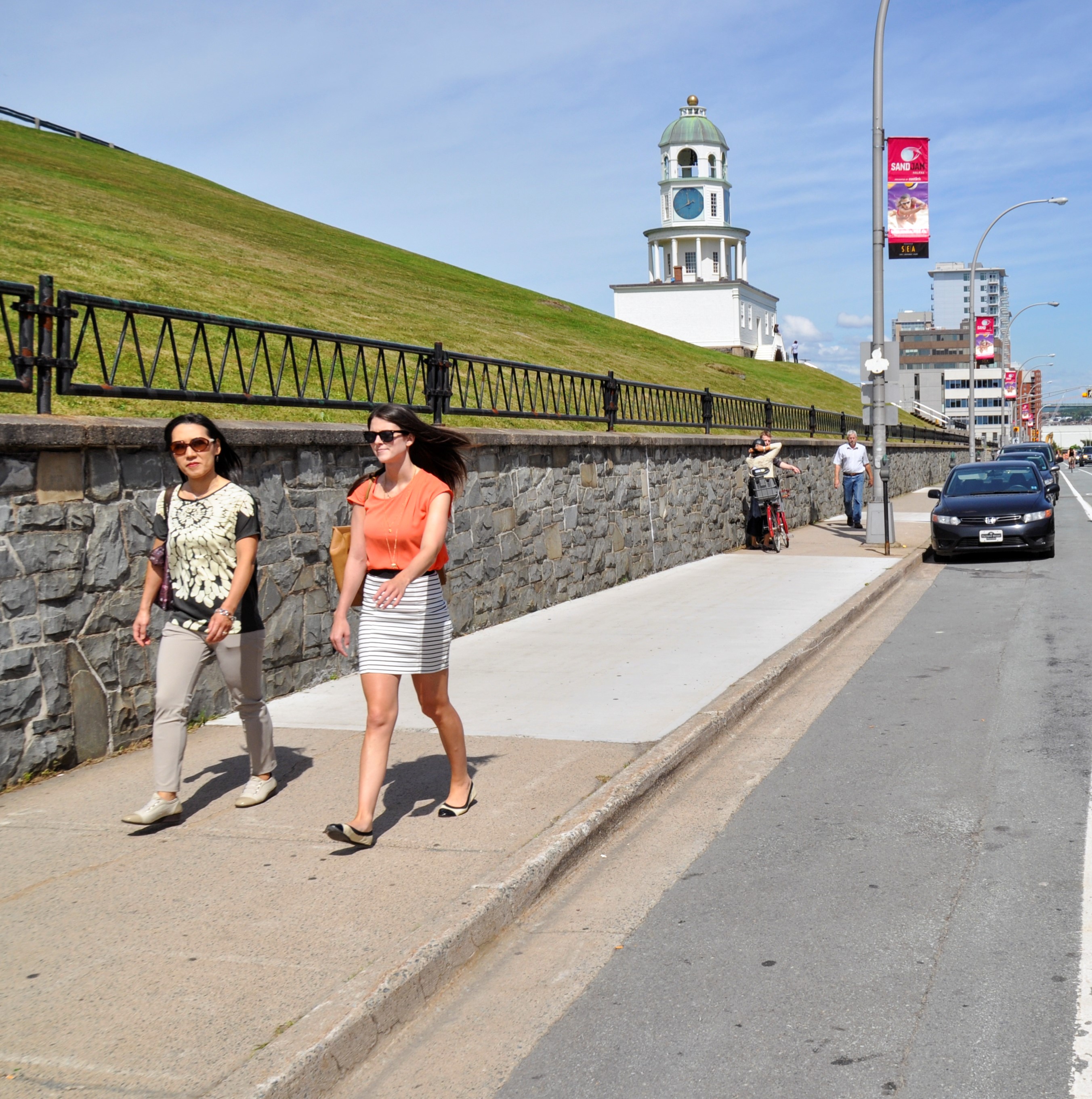 People walking down the sidewalk on Brunswick Street