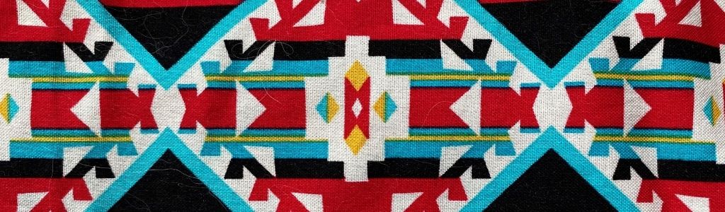 a colourful cloth patterned with traditional Indigenous designs 