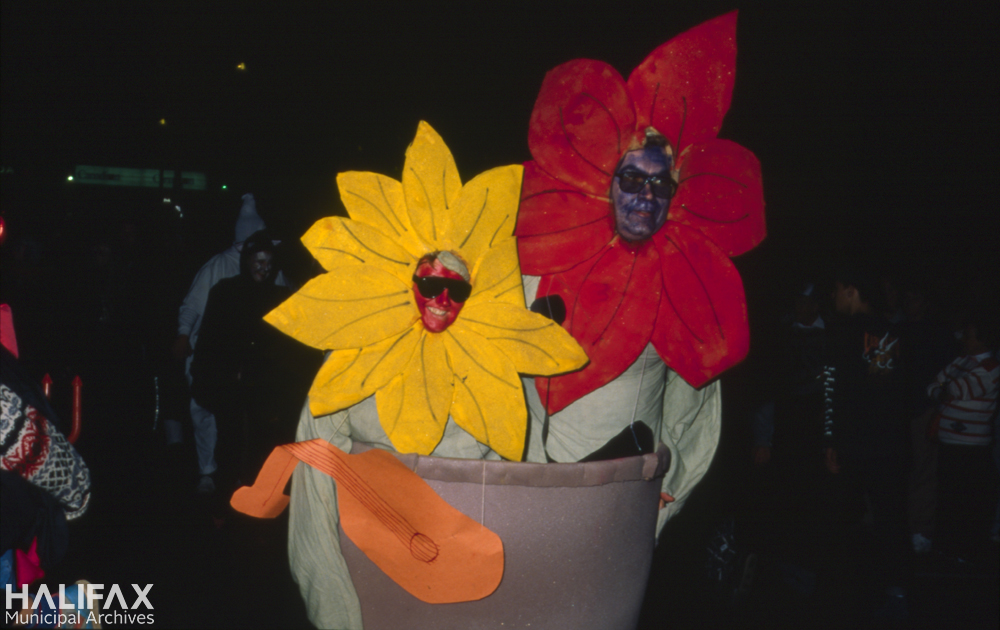 Colour photo of two participants in a flower pot costume