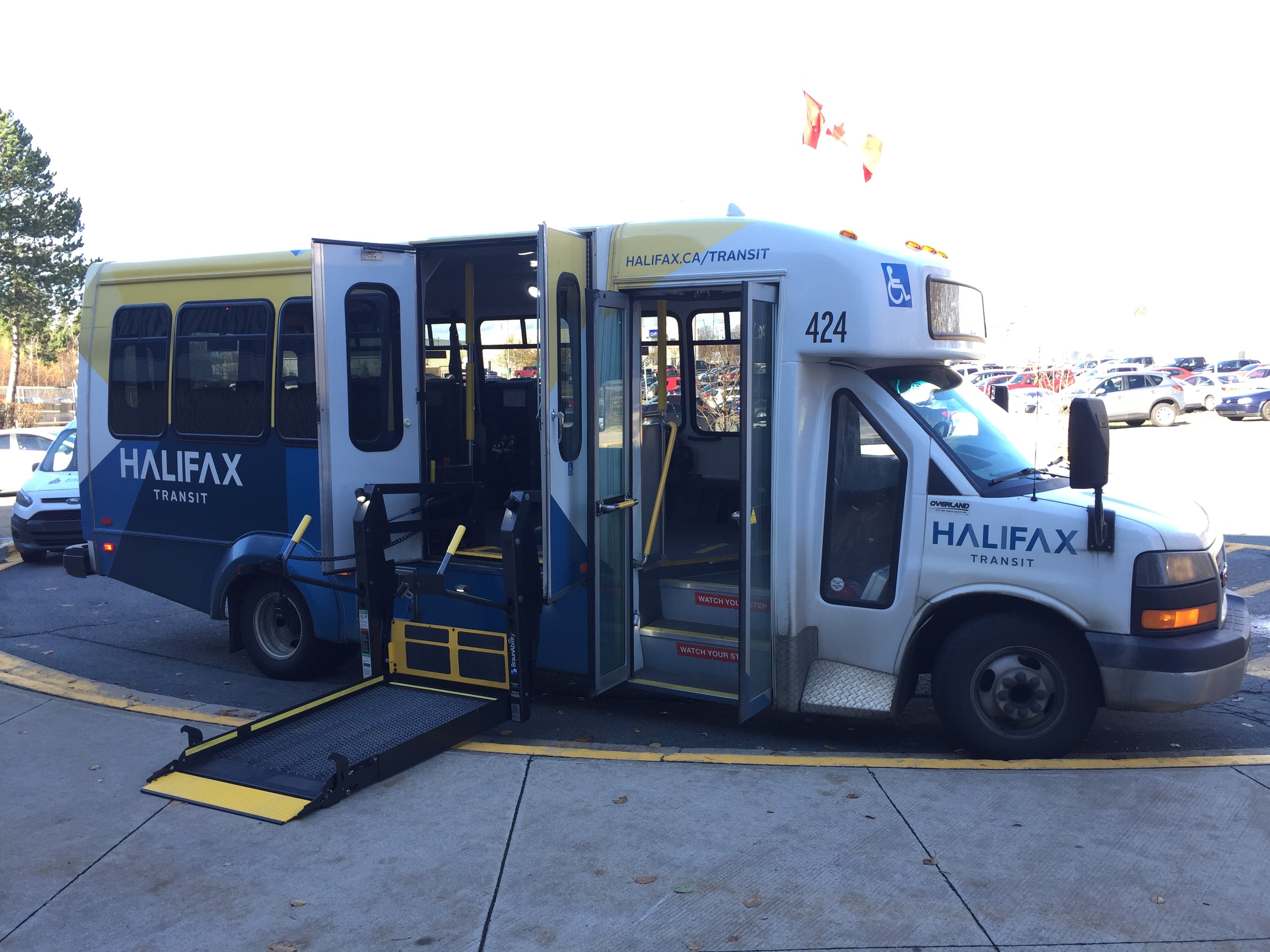 A Halifax Transit Access-A-Bus is stopped and has the doors open and the wheelchair ramp in the loading position.