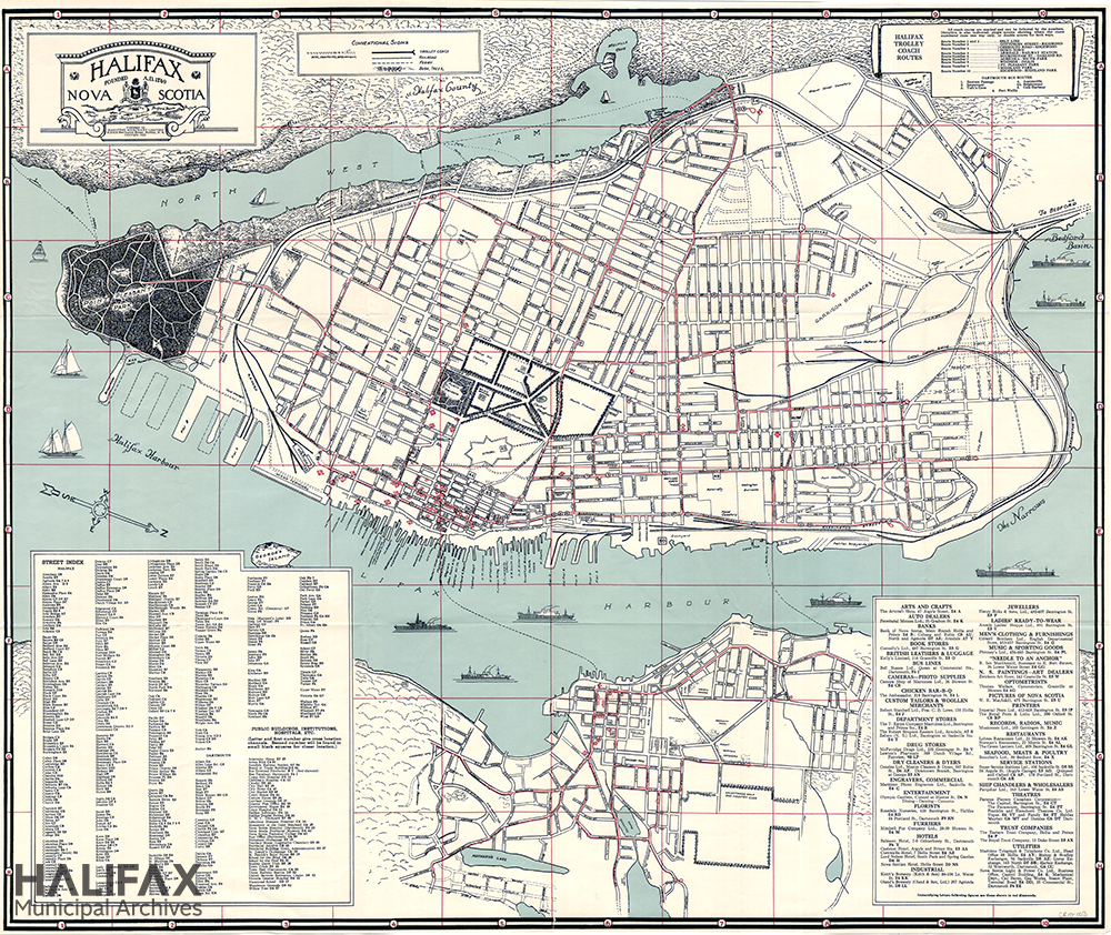 Colour map of Halifax peninsula and downtown Dartmouth showing streets, businesses, public buildings, trolley coach routes, and names of wharves. 