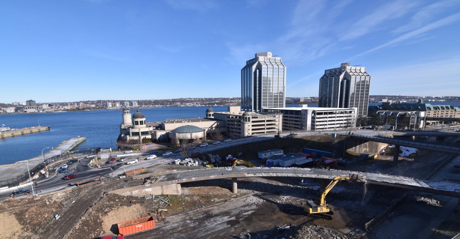 View of the Cogswell District. An excavator tears down a ramp. 