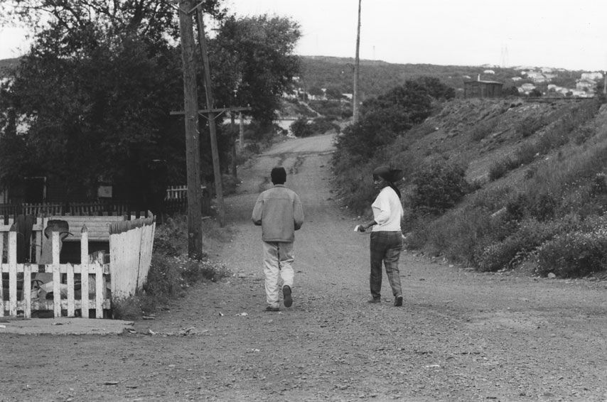 Two youths walk together in Africville