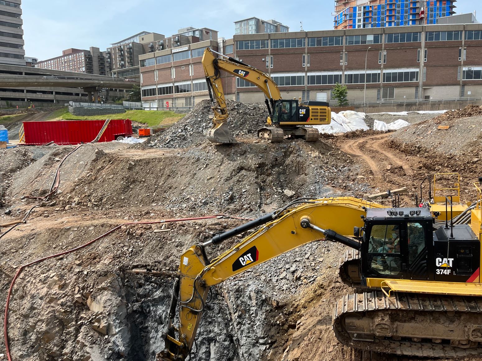 Two excavators at work in the Cogswell District
