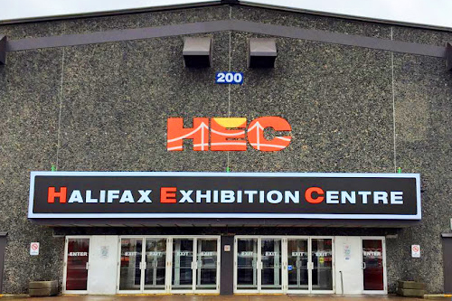 A spacious venue with large orange letters spelling "HEC."