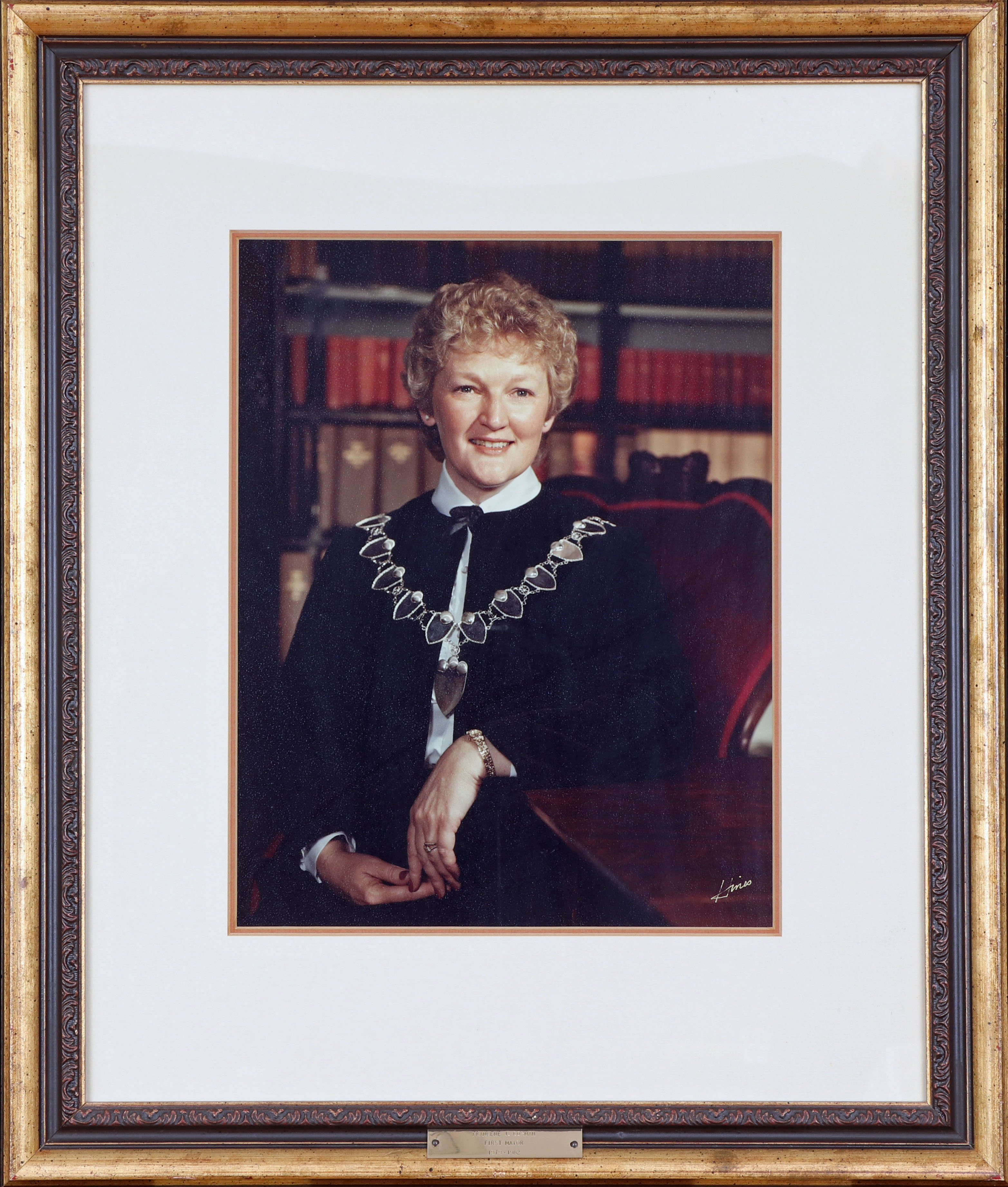 Coloured photograph of a woman wearing a dark blue robe and the mayor's chain of office