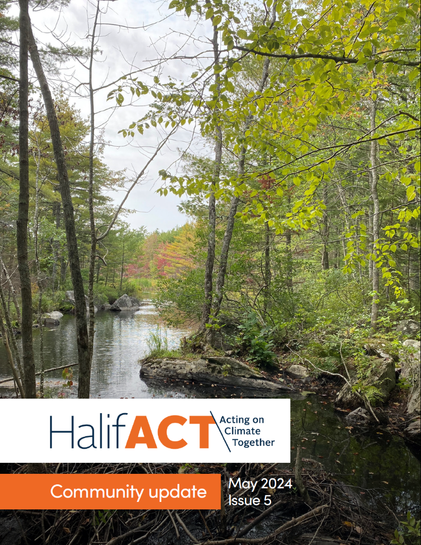 Cover of fifth community update. Depicts a wooded hiking trail with water in the centre.