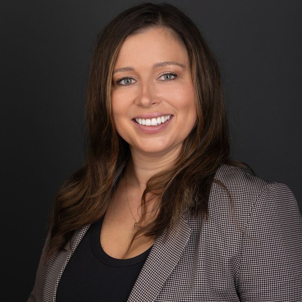 Woman smiling at camera.