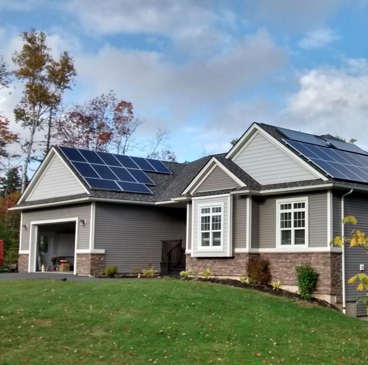 Photo of a home with solar panels on the roof.