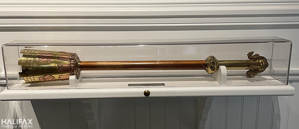 Colour photo of silver mace in glass cabinet