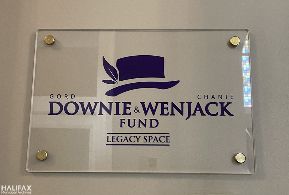 photo of the sign for the Gord Downie and Chanie Wenjack Fund Legacy Space, underneath Downie's signature hat