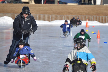 Children using sledges at the Emera Oval