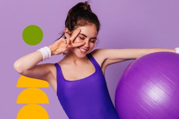 A bright purple background with a resident in athletic wear posing for a photo while participating in an excercise class.