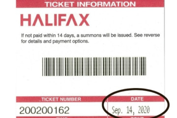 A parking ticket with the Halifax logo, a barcode and the date of the offense circled in black.