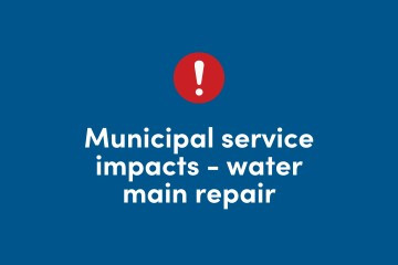 Navy blue background with red circle and a white icon exclamation point. Caption under with words "Municipal service impacts- main repair." Halifax logo in white letters.