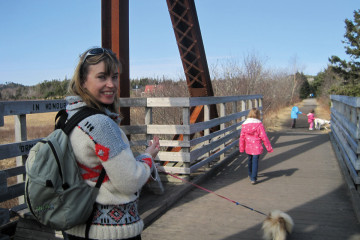 Lady walking her dog across the bridge on the Musquodoboit Trailway