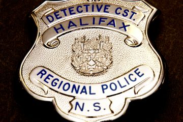 Close up of a detective's badge