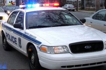 Photo of patrol cruiser with lights flashing