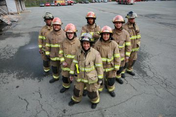 Firefighters standing in a V formation