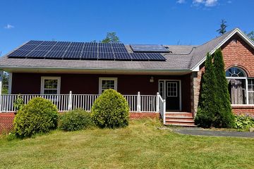 Brown house with solar panels on the roof