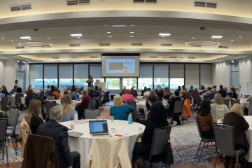 Conference delegates gather in the ballroom for keynote presentation 