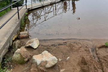 an image of a shoreline and part of a dock