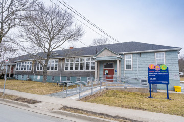Exterior of the Findlay Centre in Dartmouth with the REC sign in front