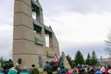 Crowd of people at the Needham Bell Tower