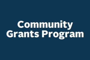 a blue square graphic with centered white text that reads Community Grants Program