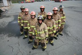 Firefighters standing in a V formation
