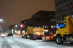 plowing downtown street at night