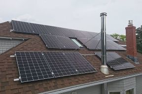 Multiple solar panels on a house roof