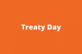 Orange background with the words Treaty Day in white text