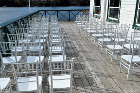 A photo of chairs set up on the deck of the boat club