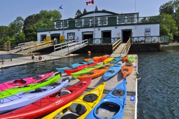 kayaks sit beside the boat launch at St. Mary's Boat Club